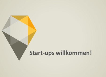 Auf grauem Grund steht der Schriftzug: Start-ups willkommen!